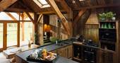 Kitchen equipped with an oven, stove, undercounter fridge and cooking utensils